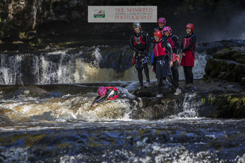 Activity adventure group during canyoning in Wales